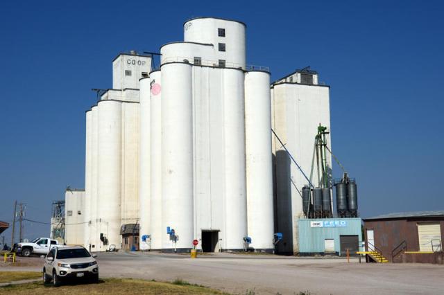 The Mayer-Osborn elevator, identified by manhole covers inside the driveway, stands in front of Chalmers and Borton additions