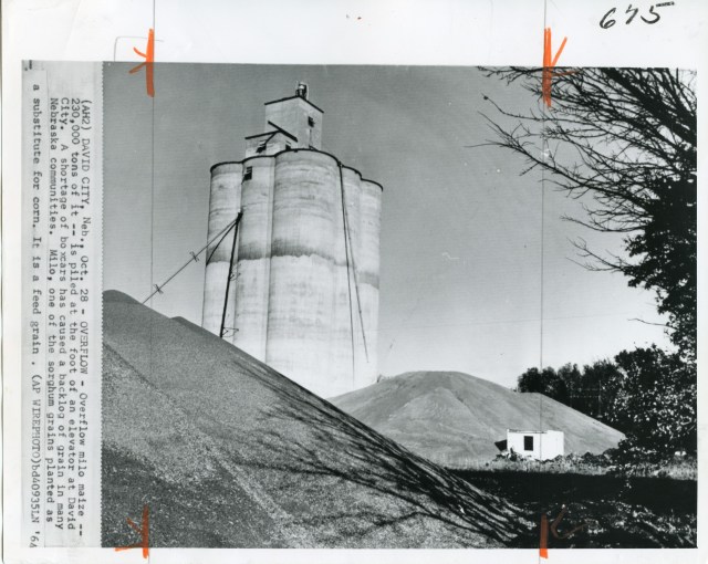 A historical image taken in David City, dated October 28, 1964. This is not the Tillotson Construction elevator, but it's neighbor a short distance down the rail line.