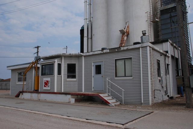 The scale house at Bradshaw, Neb. sports new siding over its concrete walls. Photo by Kristen Cart