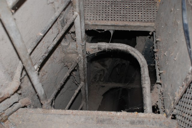 Pit access by ladder. The leg is visible.