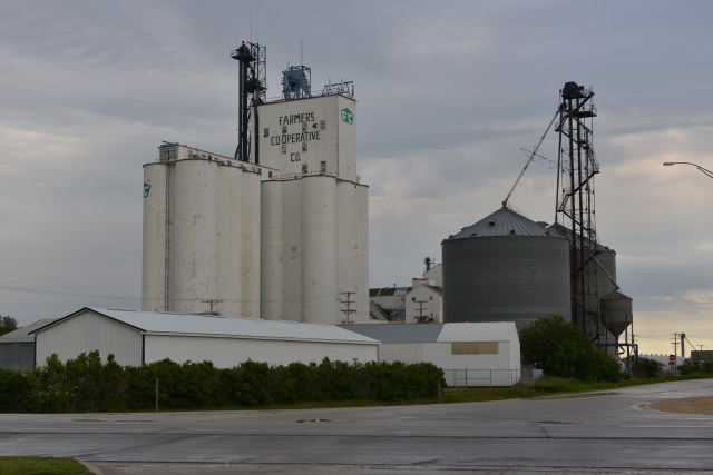 The old elevator sits beside its wooden predecessor, as it did in 1946